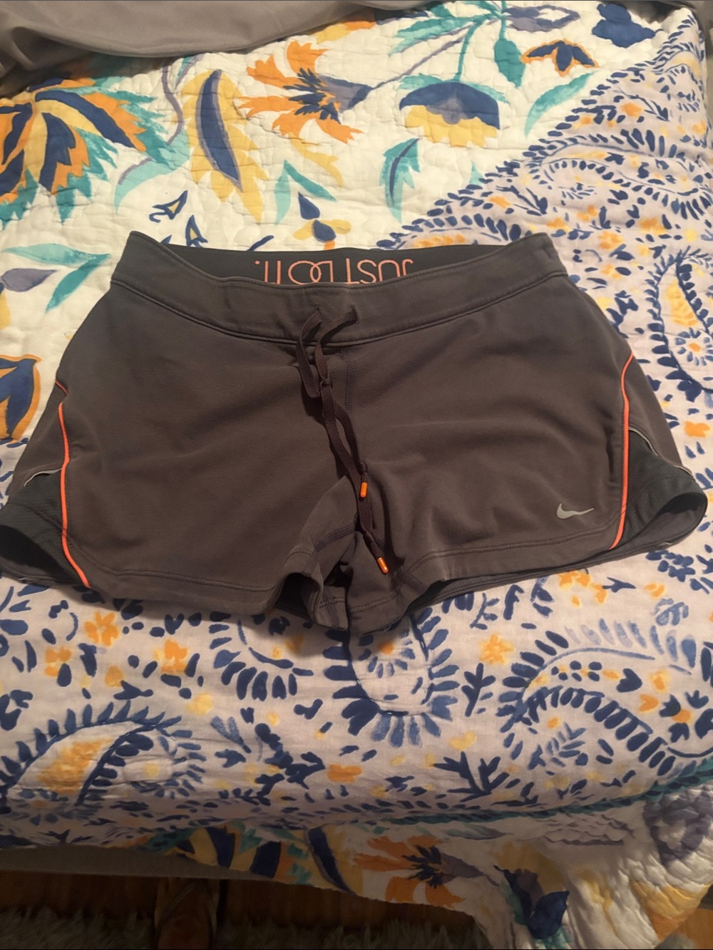 Nike Women’s Charcoal Athletic Shorts with Orange Piping